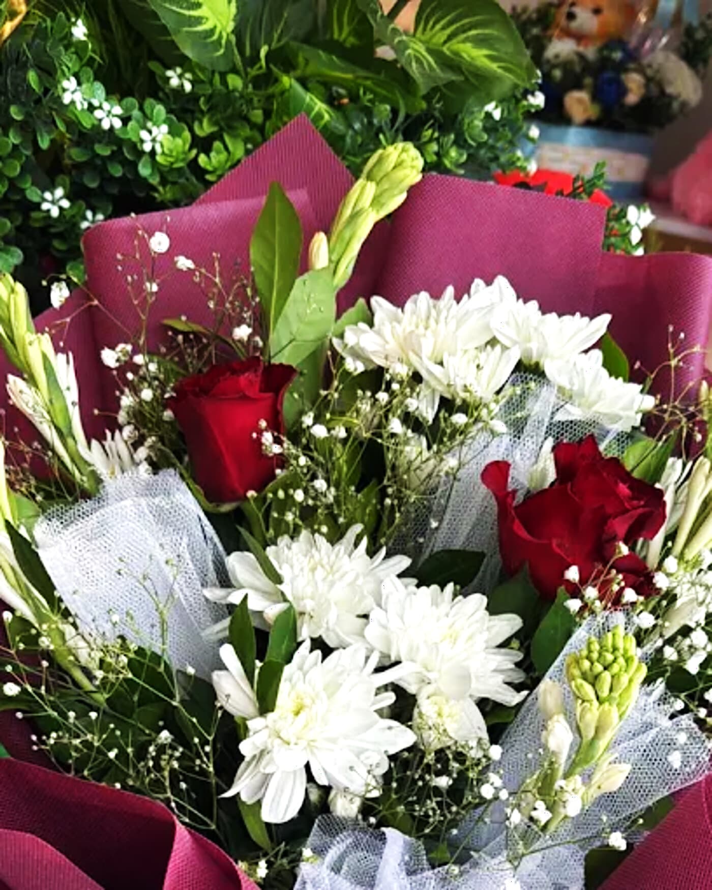 Burgundy tulle rose bouquet by Phool Pattiyan Lahore